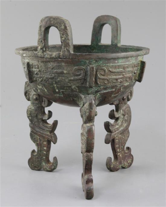 A Chinese archaic bronze tripod ritual food vessel, late Shang/early Western Zhou dynasty, 23cm high, repairs